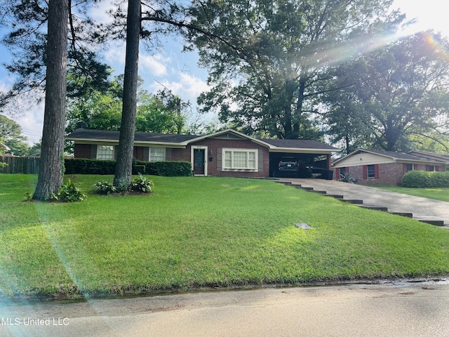 5751 Orchardview Dr, Jackson, MS 39211 - single story home featuring concrete driveway, a carport, brick siding, and a front lawn
