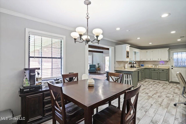 5751 Orchardview Dr, Jackson, MS 39211 - dining area featuring a chandelier, ornamental molding, and recessed lighting