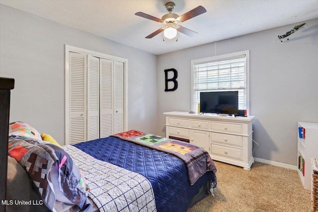 5751 Orchardview Dr, Jackson, MS 39211 - bedroom with a closet, light carpet, a ceiling fan, and baseboards