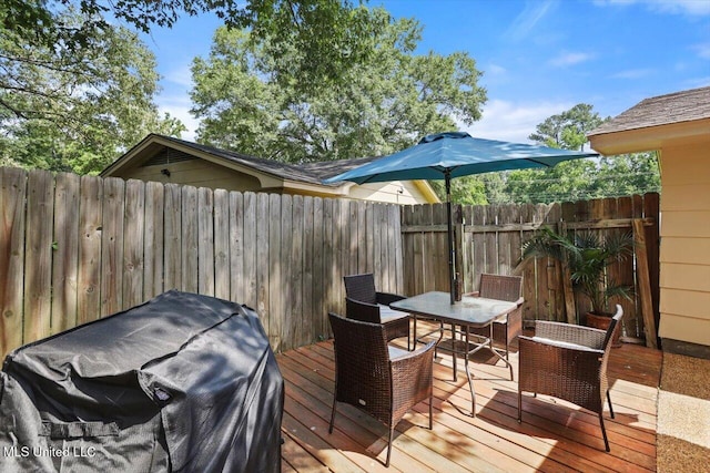 5751 Orchardview Dr, Jackson, MS 39211 - wooden deck featuring outdoor dining space and a fenced backyard