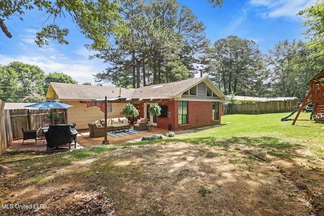 5751 Orchardview Dr, Jackson, MS 39211 - rear view of property with outdoor lounge area, a playground, brick siding, and a patio area