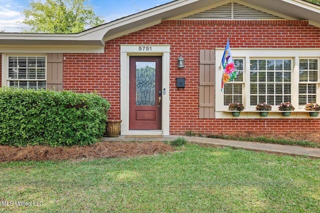 5751 Orchardview Dr, Jackson, MS 39211 - entrance to property featuring brick siding and a yard
