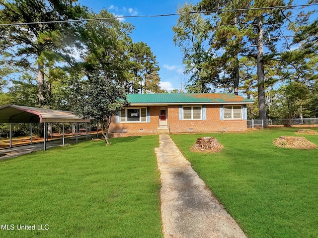 view of front facade with a front lawn and a carport