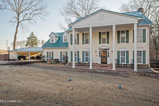 neoclassical / greek revival house with a porch