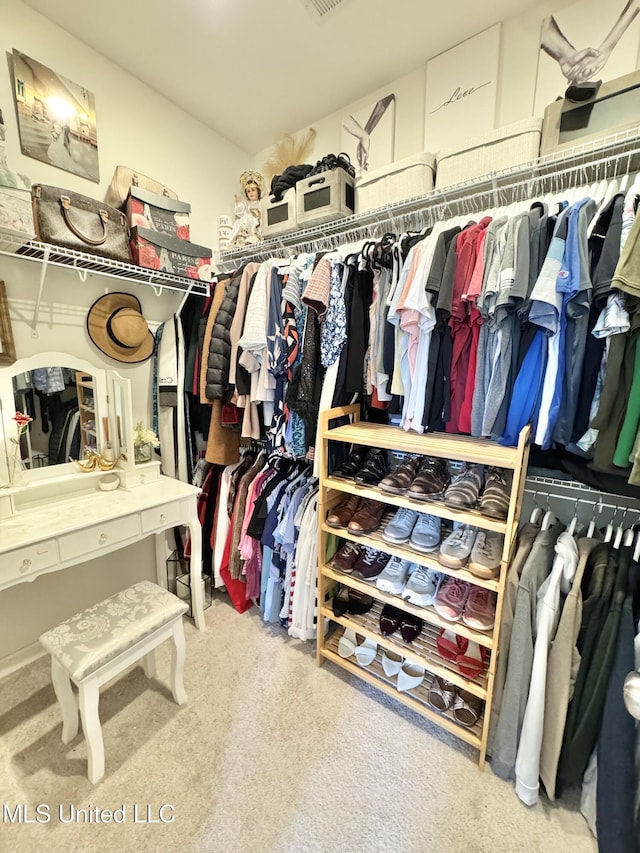 spacious closet featuring visible vents and carpet