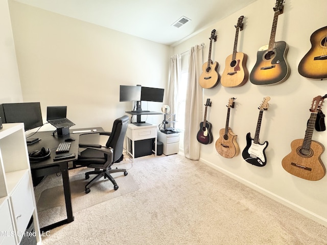 office space with baseboards, visible vents, and carpet floors