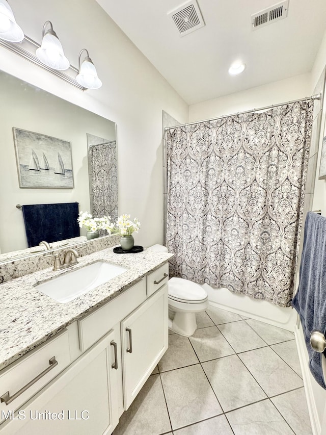 bathroom with toilet, tile patterned flooring, vanity, and visible vents