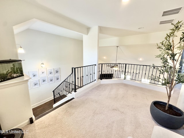 interior space featuring baseboards, recessed lighting, visible vents, and carpet
