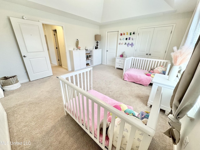 bedroom with light carpet and baseboards