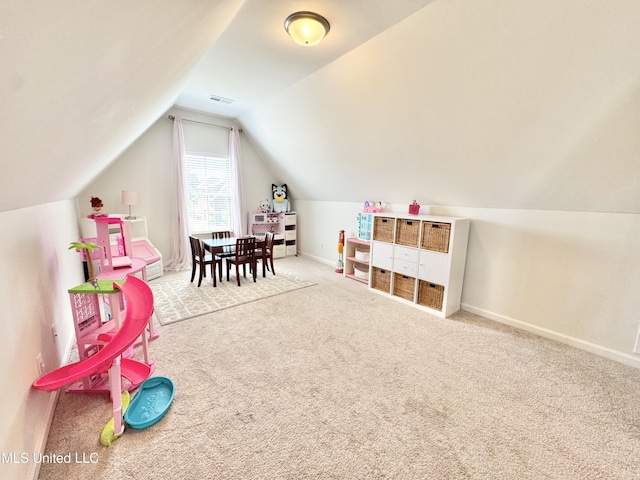 playroom featuring visible vents, baseboards, lofted ceiling, and carpet floors