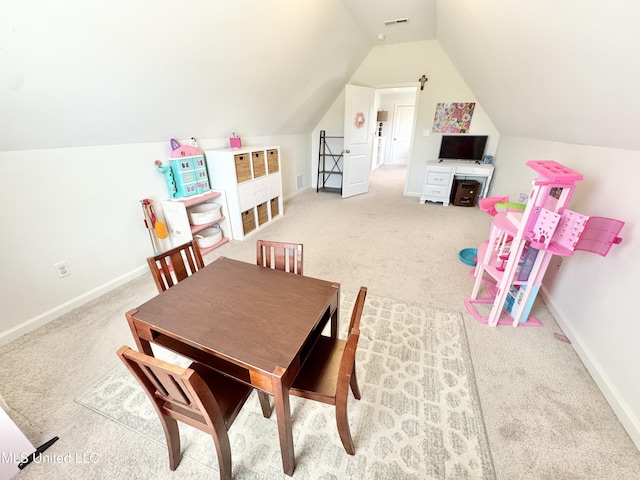 game room with baseboards, light carpet, visible vents, and vaulted ceiling