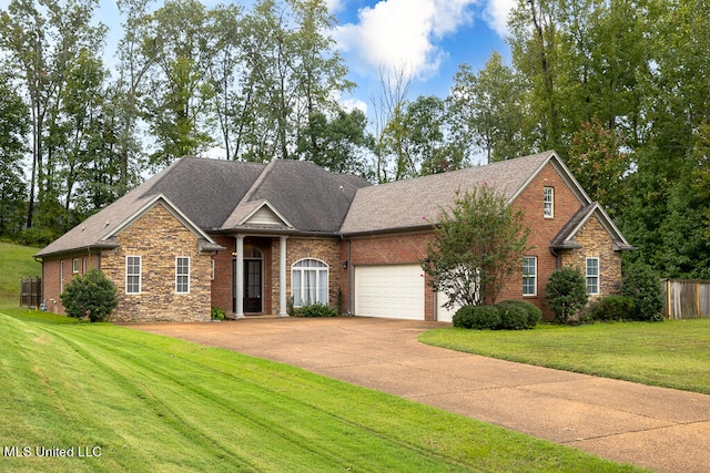 view of front of house with a front lawn and a garage