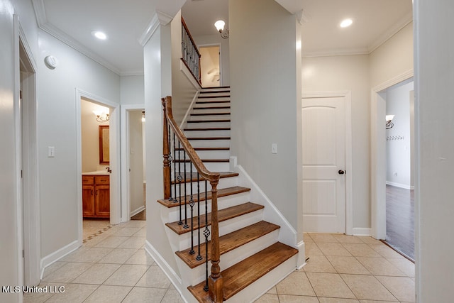 stairs featuring crown molding and tile patterned flooring