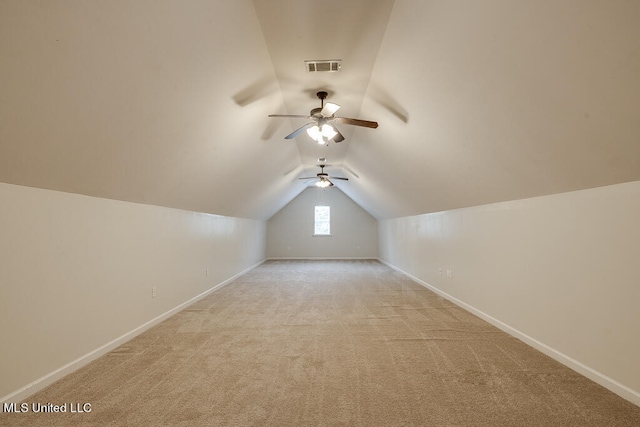 bonus room with vaulted ceiling, light carpet, and ceiling fan