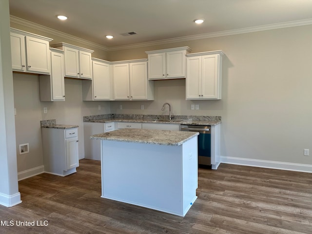 kitchen with a kitchen island, white cabinetry, and dishwasher