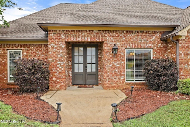 106 Sumter Dr, Canton, MS 39046 - doorway to property with a shingled roof and brick siding