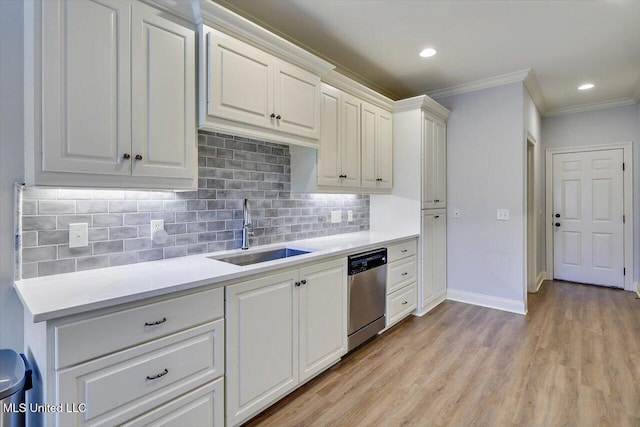 106 Sumter Dr, Canton, MS 39046 - kitchen featuring stainless steel dishwasher, a sink, crown molding, light countertops, and tasteful backsplash