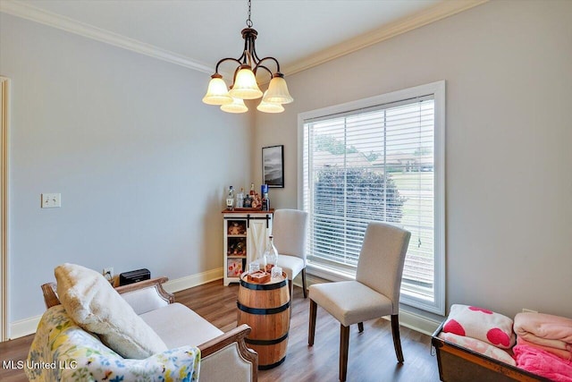 106 Sumter Dr, Canton, MS 39046 - living area with crown molding, a chandelier, wood finished floors, and baseboards