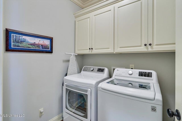 106 Sumter Dr, Canton, MS 39046 - laundry room featuring washer and dryer, cabinet space, and baseboards