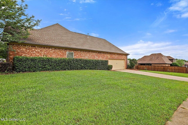 106 Sumter Dr, Canton, MS 39046 - view of side of property featuring concrete driveway, brick siding, an attached garage, and a shingled roof