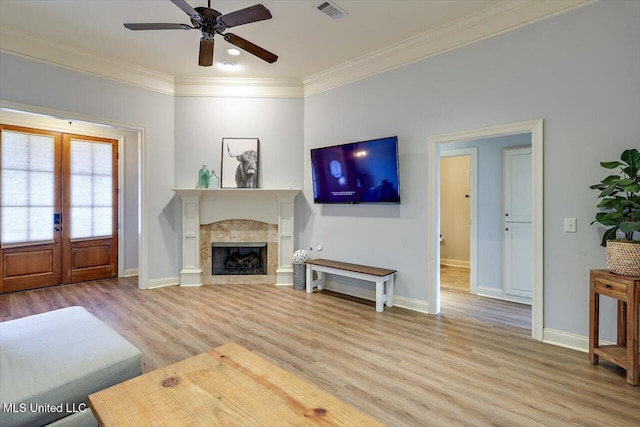 106 Sumter Dr, Canton, MS 39046 - living area featuring light wood-style floors, ceiling fan, crown molding, baseboards, and a fireplace