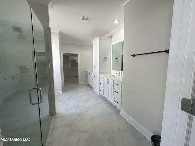 bathroom featuring vanity, crown molding, and an enclosed shower