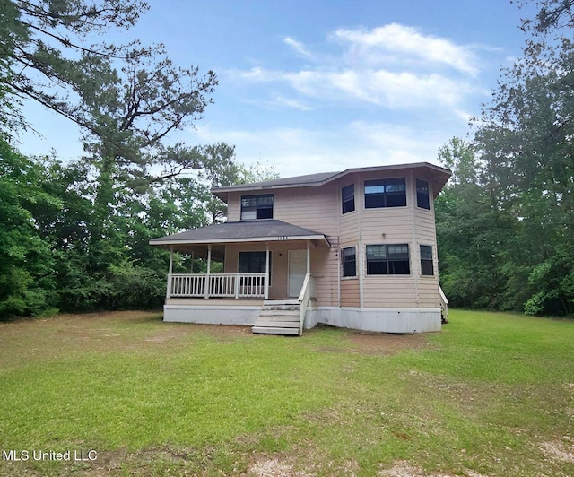 1124 J J Carter Rd, Magnolia, MS 39652 - view of front facade with covered porch and a front yard