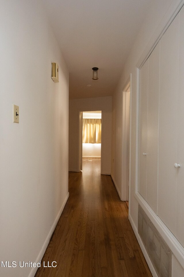 hall with dark hardwood / wood-style floors