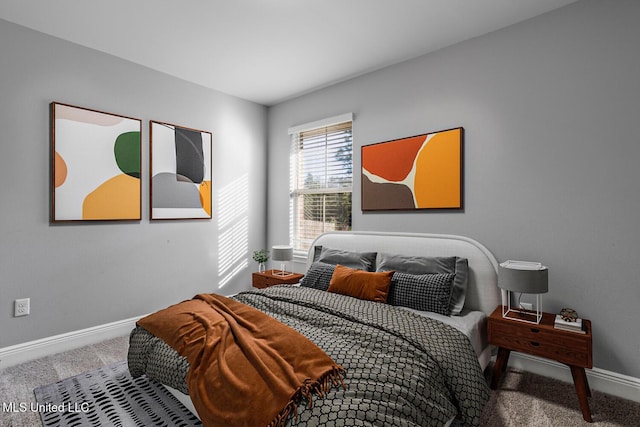 carpeted bedroom featuring baseboards