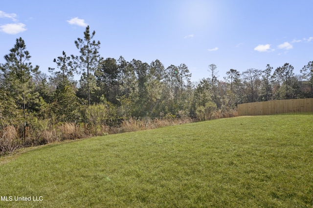 view of yard featuring fence