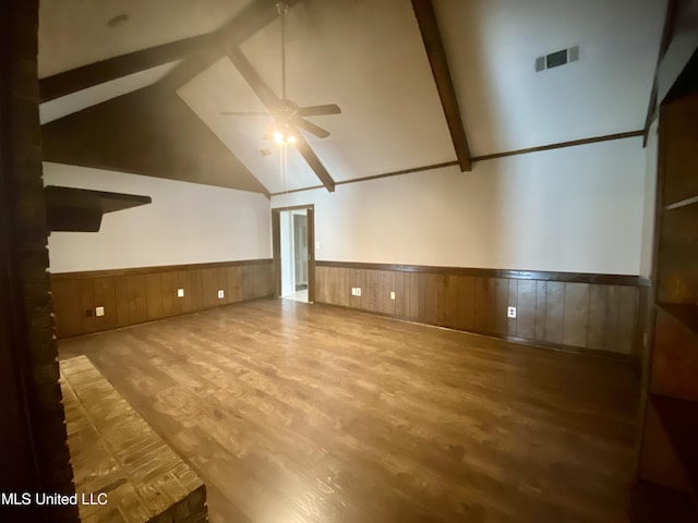 bonus room featuring hardwood / wood-style floors, ceiling fan, beam ceiling, and high vaulted ceiling