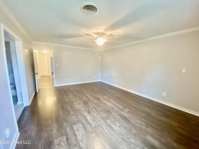 spare room featuring dark hardwood / wood-style floors, ceiling fan, and crown molding