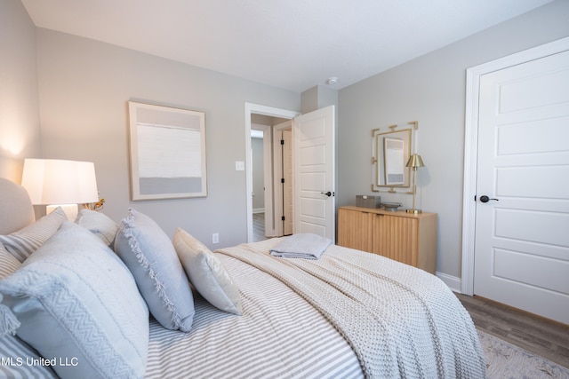 bedroom with wood-type flooring