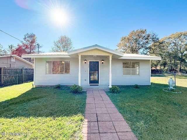 ranch-style home with a front lawn