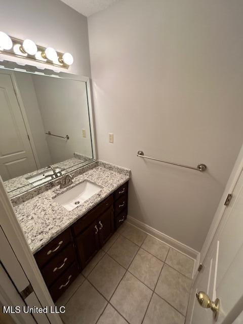 bathroom with vanity and tile patterned flooring