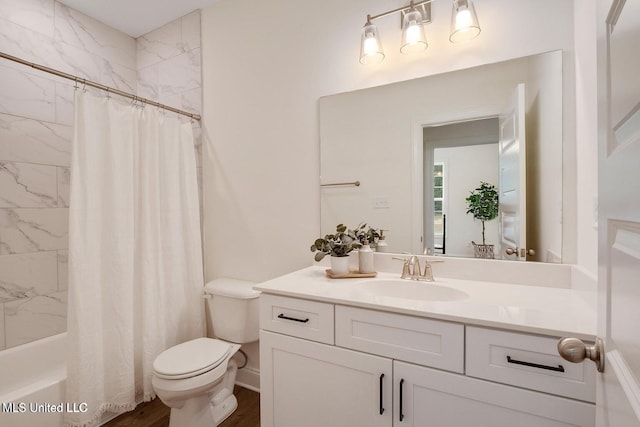 full bathroom with vanity, wood-type flooring, shower / tub combo with curtain, and toilet