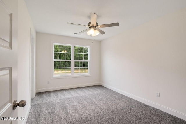 spare room with carpet flooring and ceiling fan