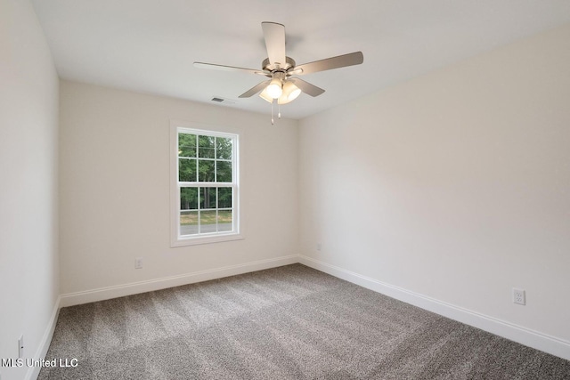 spare room with carpet floors and ceiling fan