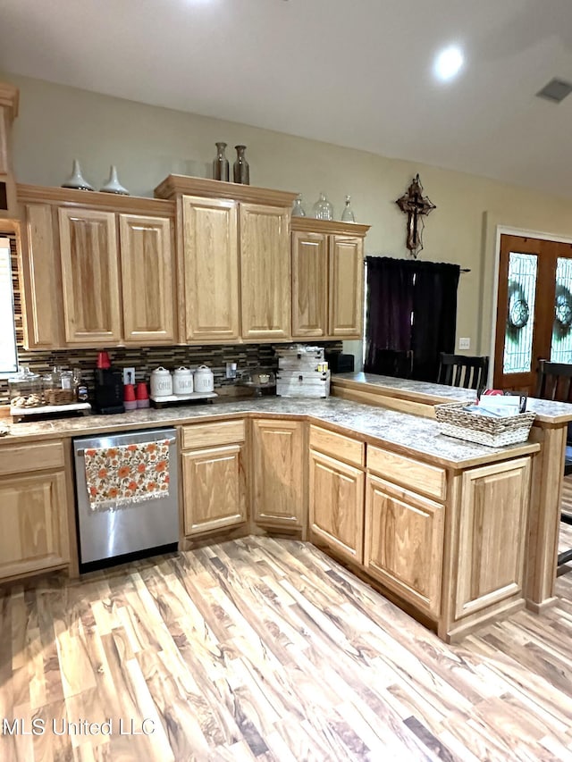 kitchen with decorative backsplash, light hardwood / wood-style flooring, kitchen peninsula, and stainless steel dishwasher