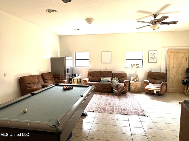 rec room with billiards, light tile patterned floors, and ceiling fan