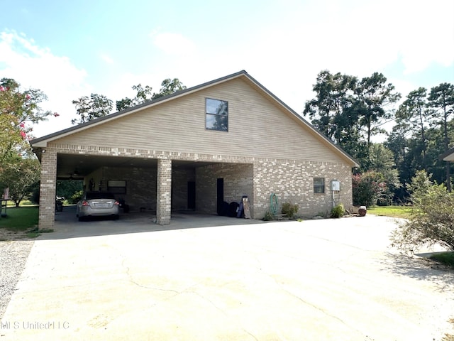 view of home's exterior with a carport