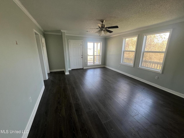 interior space with a textured ceiling, crown molding, and dark wood-type flooring