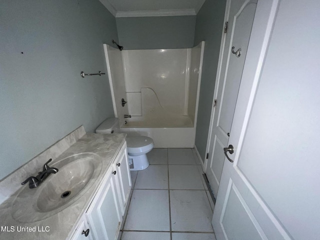 bathroom featuring vanity, tub / shower combination, ornamental molding, tile patterned flooring, and toilet