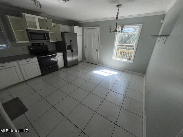 kitchen featuring dark countertops, appliances with stainless steel finishes, white cabinets, crown molding, and light tile patterned floors