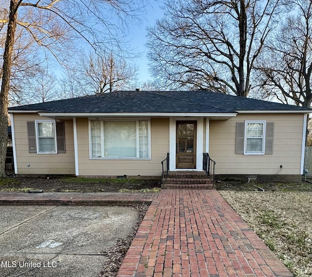 1009 Avery St, Cleveland, MS 38732 - view of front of home featuring a shingled roof and entry steps