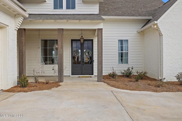 doorway to property featuring french doors and a porch