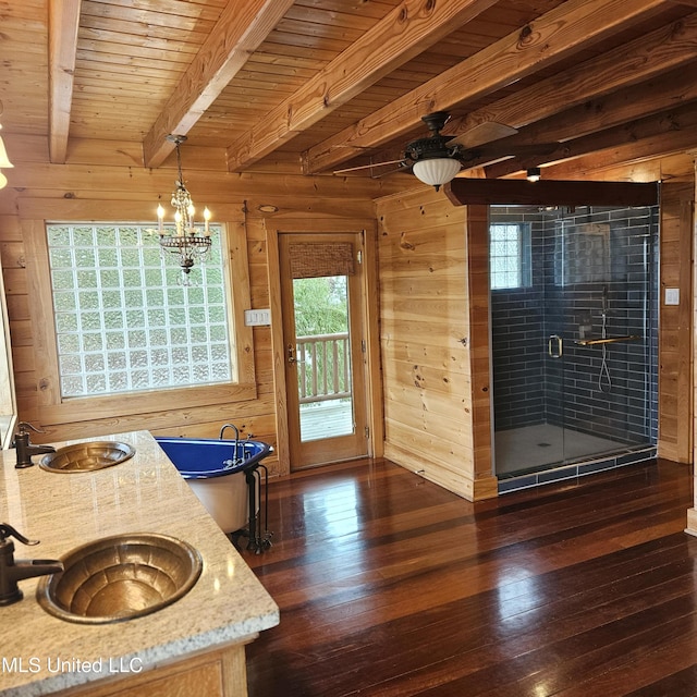 bathroom with beam ceiling, wood ceiling, wooden walls, and wood-type flooring