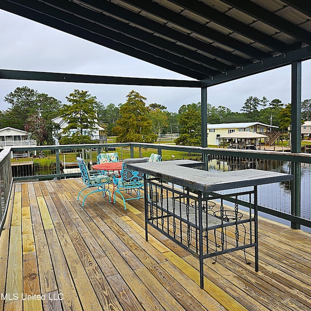 wooden terrace with a water view