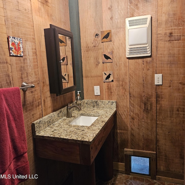 bathroom with vanity and heating unit