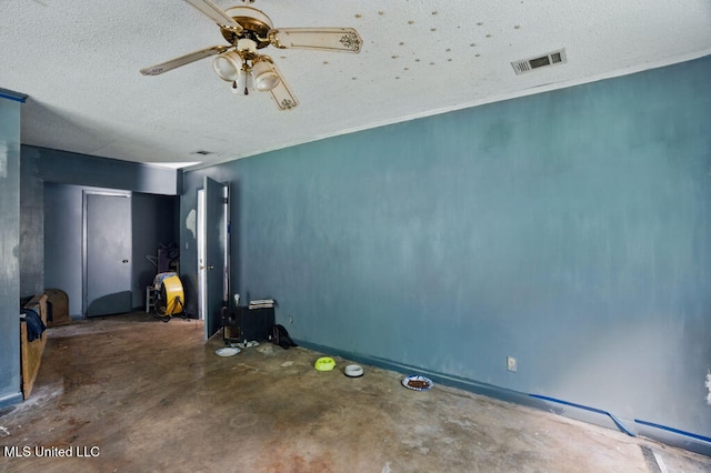 9 Gail St, Hattiesburg, MS 39402 - spare room with unfinished concrete flooring, a textured ceiling, and a ceiling fan